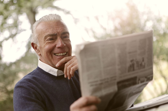 Single Senior Mister reading newspaper